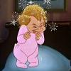 A cartoon character in pink pajamas stands with hands near face, blonde hair, and a blue floor background with white sparkles.