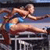 Pixelated static image of a female athlete in mid-jump over a hurdle, wearing a blue and white uniform with brown hair tied back.
