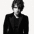 Two grayscale images of a person in different poses with text below reading 'Say what you need to say.'