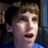 A pixelated image shows a person with light brown hair and blue clothing on the left, next to yellow text reading 'Supermao 18' on a white background.