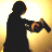 Silhouette of a figure holding a chainsaw against a gradient background of yellow and white pixels.