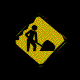 Yellow diamond-shaped warning sign with black silhouette of worker holding shovel and pile of dirt, displayed in a