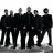 Black-and-white group photo of seven figures in dark clothing on left; green text with pixelated font on right and bottom, gray top-right