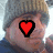 A pixelated image of a person wearing a knit hat with text and symbols changing across frames.