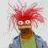 Pixelated cartoon character with red spiky hair and glasses next to pixelated text reading 'I'm so darn sexy it hurts!' on a white background.