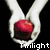 Two hands hold a red sphere and a bloodied fist above chess pieces with text labels on a black background.