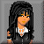 Pixel art of a character with long black hair, orange skin, and yellow eyes wearing a white shirt under a dark jacket against gray background.