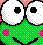 Pixelated green cartoon character with large white eyes, black pupils, and a wide smile; pink accents on the head and body.