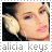Alicia Keys icon with two side-by-side pixelated images showing her face and headphones, text below each image.