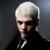 A four- shows a person with short white hair in black clothing against dark gray backgrounds, with one containing text
