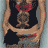 Animated contact sheet showing six frames of a woman in a black tank top with red accents and a central emblem, transitioning through different poses and expressions against a light blue background.
