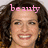 Pixelated close-up of a person with curly brown hair and pink text above the head reading 'be auty' in lowercase letters.