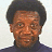 Pixelated image of a person with short dark hair wearing a dark turtleneck, next to blue text reading 'Queer Eye' and 'OriginalIcons.com' on black backgrounds.