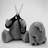Pixelated grayscale icon shows two figures: one with raised arms and a dark top, the other seated with visible limbs against light background.
