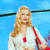 A pixelated image of a woman with long blonde hair wearing a white top and red shoulder strap against a blue background, next to green text reading "Original Icons .com" on a dark green background.