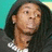 Pixelated image of a person with long dark hair wearing a dark hoodie and white shirt, set against a teal background.