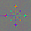 A dense of repeating circular patterns with shifting rainbow-colored outlines on a gray background, forming an animated optical illusion