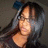 Pixelated image of a person with long dark hair, light skin tone, and visible facial features including eyes, nose, and mouth.