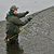 A pixelated figure in dark clothing and a cap holds a long object horizontally with both hands against a gray background.