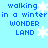 Pixelated blue text on light blue background reads "walking in a winter wonder land" with white snowflakes scattered across the image.