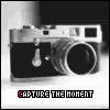 Black-and-white image of a vintage camera with a lens, flash, and viewfinder, positioned horizontally on a light background with text below.