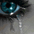Animated sequence showing a blue eye with a black pupil, transitioning to a couple sitting on a bench, then to a heart shape, and finally to a couple embracing.