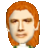 Pixelated portrait of a person with orange hair, light skin, and closed eyes, wearing a white top with green accents against a gray background.