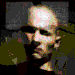 Animated sequence of a person with light skin and short dark hair in a dark shirt, showing facial expressions and hand movements against a dark background.