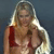 Pixelated image of a person with long blonde hair wearing a red bikini top, standing against a dark blue background.
