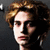 Pixelated image of a person with light brown hair and dark clothing, alongside yellow text reading "cuz ars mak a man SEXY!!" on white background.