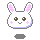 Pixelated bunny head with pink inner ears, green eyes, pink blush marks, and a small smile on a gray background.