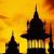 Pixelated image of two dark spired structures against a yellow-orange gradient background with visible pixelation and color blending.