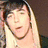 A static image with a light blue background featuring white cloud and heart shapes, displaying text about loving Colin Baylen.
