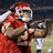 Pixelated image of a person in red sports uniform holding football, wearing Santa hat with white trim and red pom-pom.