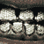 A 3x2 contact sheet of pixelated animated frames showing a mouth with teeth and a face, featuring a white stylized logo on the bottom right frame.