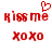 Red pixelated text 'kiss me' with a heart symbol above the 'me', and 'xoxo' below, on white background.