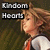 Pixelated image of a person with light brown hair wearing a white shirt and red tie, standing against dark green background with text "Random Hearts" in gray block letters.