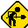 Yellow diamond-shaped warning sign with black silhouette of a person holding a shovel, showing sequential animation frames where the shovel's position changes and small pixelated debris appears.