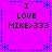 A static pixel art image with a bright purple background, blue decorative borders, and repeated text reading "I LOVE MIKE>333" in black block letters.