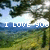 Pixelated landscape with trees and sky, overlaid with white text reading "I LOVE YOU" and "I LOVE YOU" in a different font.