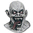 Pixelated grayscale image of a bald, pale-skinned figure with wide eyes and an open mouth showing teeth, set against white background.