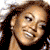 Four 50x50 pixel frames of a celebrity's face arranged in a contact sheet with varying expressions and backgrounds.