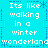 Pixelated text on a cyan background with blue decorative borders, repeating 'Its like walking in a winter wonderland' across four quadrants.