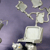 Pixelated image of a white chair with curved armrests and a rectangular seat against a purple gradient background.