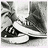 Black-and-white pixelated animation of a person's lower legs and feet in sneakers, with subtle motion changes across frames.