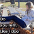Pixelated image of a person in blue clothing holding an object with visible text, set against a blurred background.
