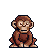 Pixel art monkey with brown fur, seated posture holding a branch-like object against gray background.