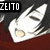 Pixelated white object with rounded edges and a central yellow spot against dark and brown background, with 'ZEITO' text in white block letters on black rectangle.