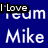 Blue background with white text reading 'Team Team Mike Mike Team Mike' and black rectangular overlays containing partial text fragments.