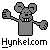 Pixelated gray mouse character with large ears, black eyes, and two white teeth, waving with one arm while holding a gray object in the other, set against a light gray background with 'Hynkelcom' text below.
